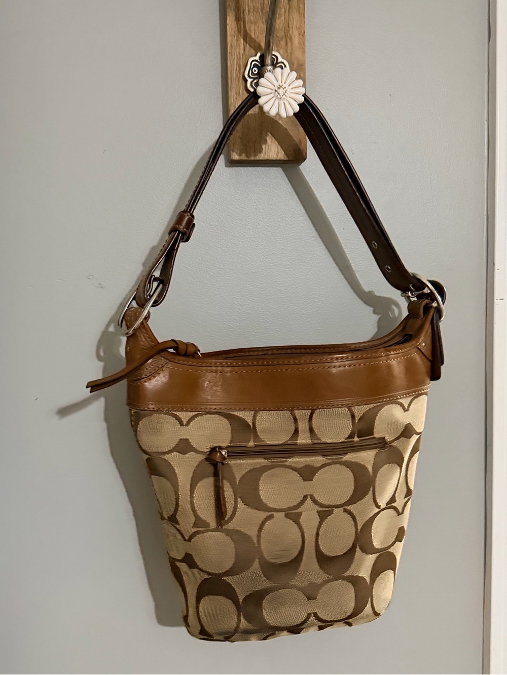Coach Brown Signature Canvas Shoulder Bag charms are not included
